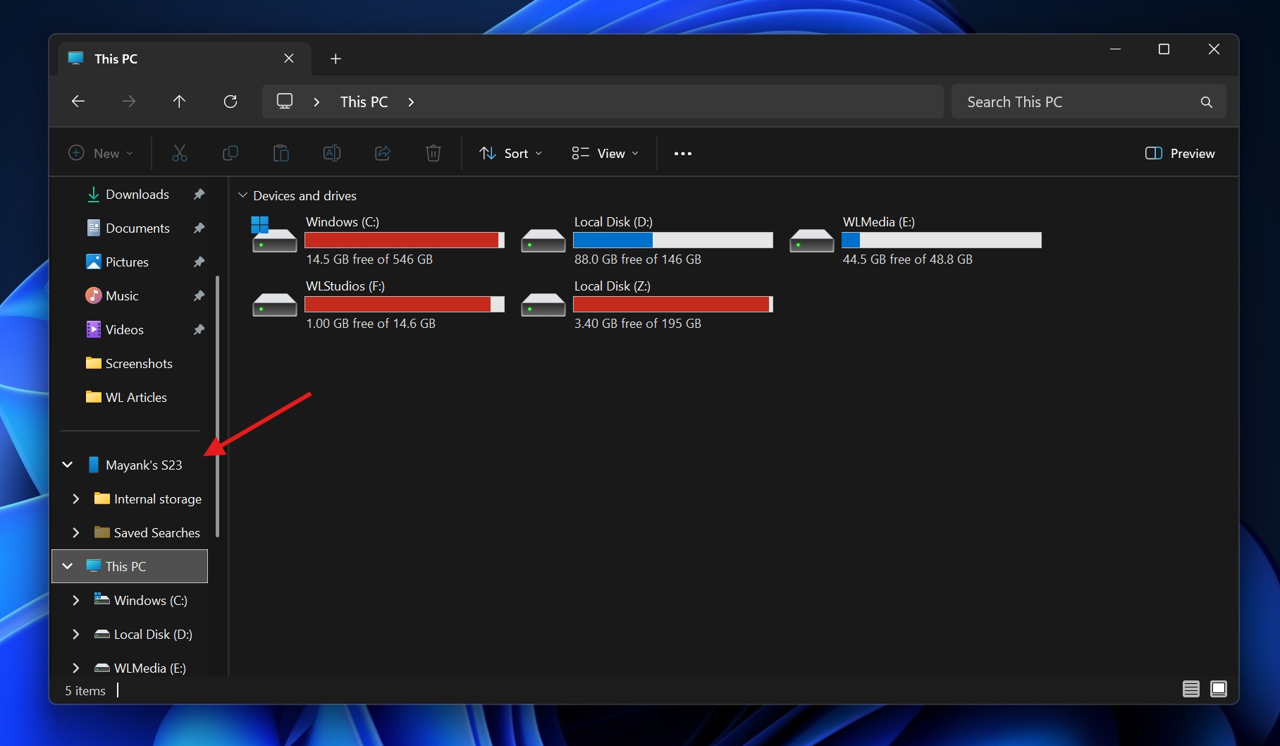 Windows 11 File Explorer with mobile device