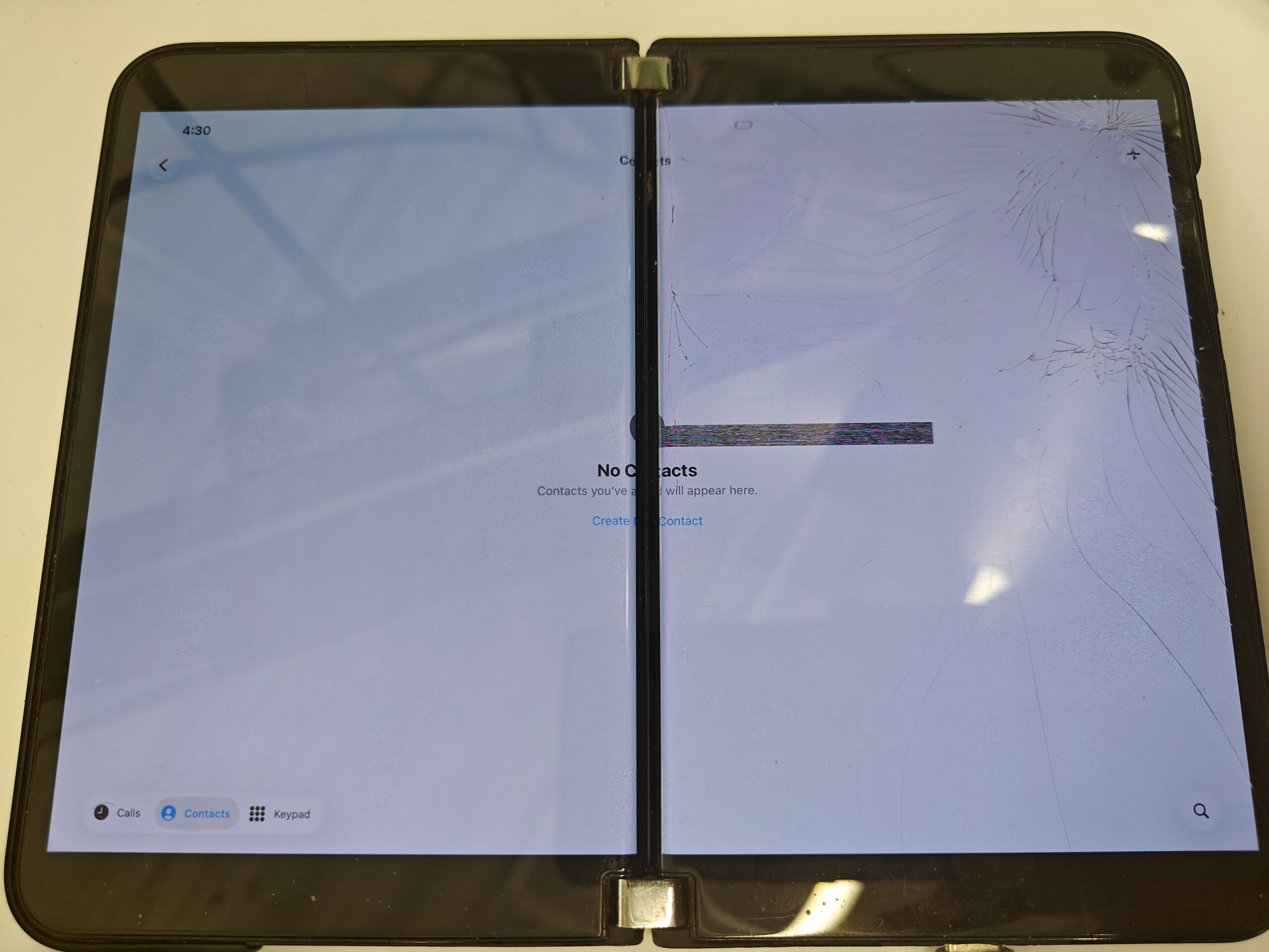 Graphics glitches still show up across the iOS 26 Contacts screen on the Surface Duo 2