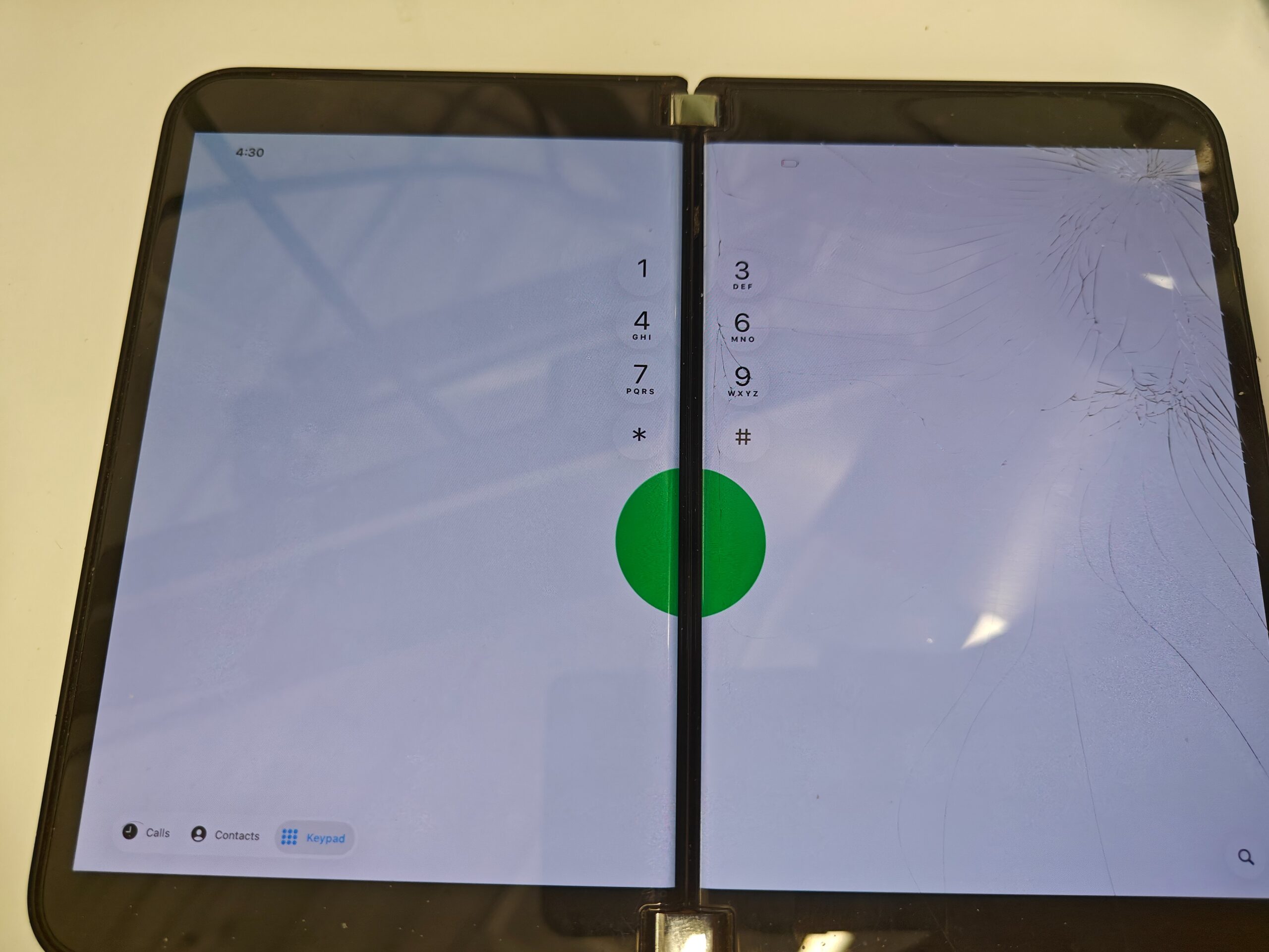 The iOS 26 Phone keypad loses its middle column to the Surface Duo 2’s hinge